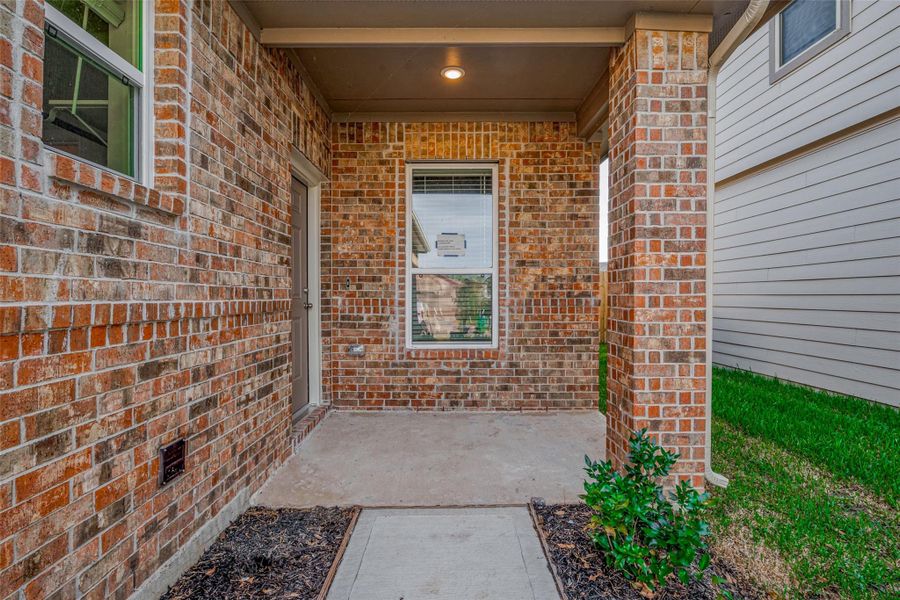 Exterior details and patio area of a home in Mill Creek Trails, Magnolia (Image 22).