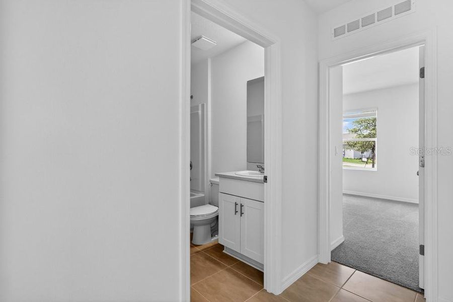Furnished interior view inside a new home in Waterstone, Groveland (Image 9).