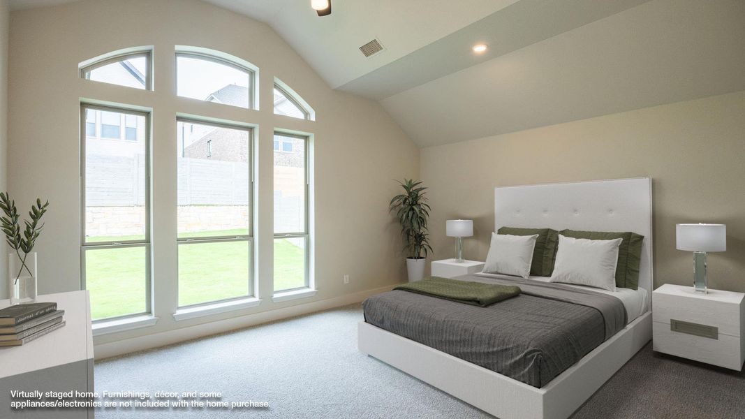 Carpeted bedroom featuring vaulted ceiling, recessed lighting, and baseboards Carpeted bedroom featuring vaulted ceiling, recessed lighting, and baseboards