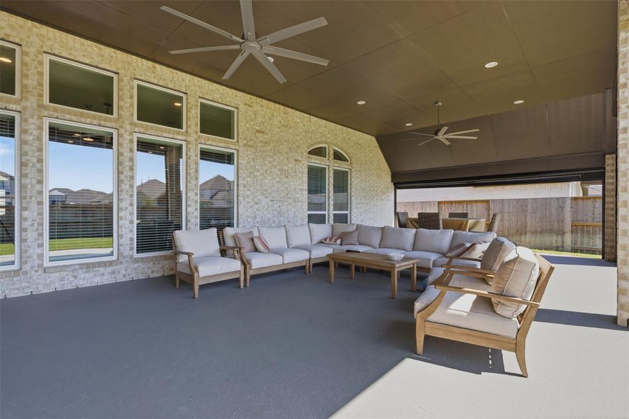 Oversized covered patio with motorizedretractable screens and multiple ceiling fanscreates an exceptional indoor-outdoorentertaining space. Oversized covered patio with motorizedretractable screens and multiple ceiling fanscreates an exceptional indoor-outdoorentertaining space.