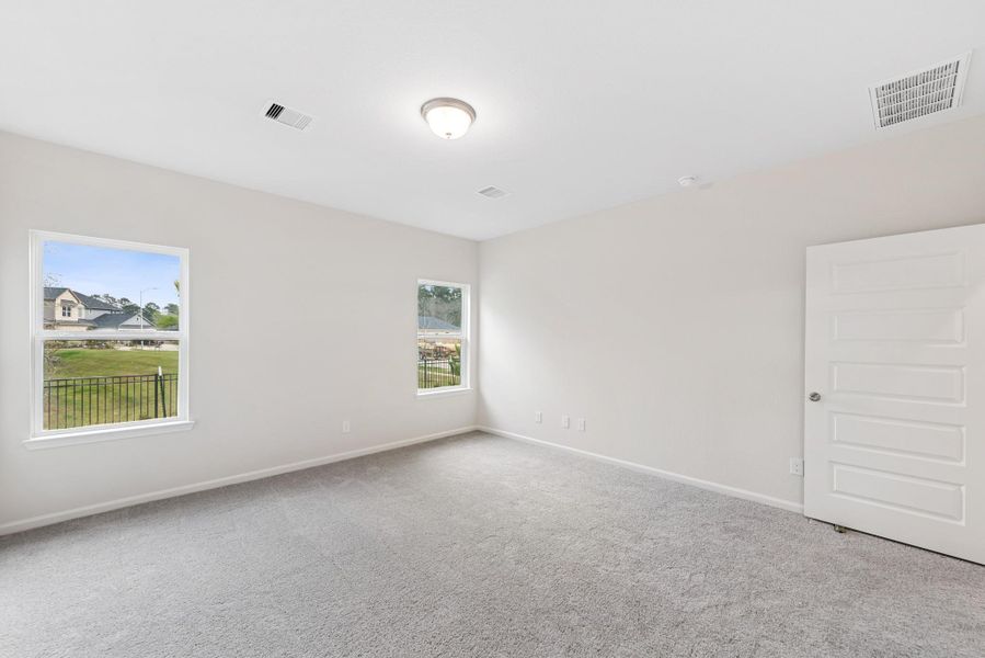 The Cardinal II- Primary Suite. Photos of home shown are for illustration only; actual features, colors, and upgrades may vary.