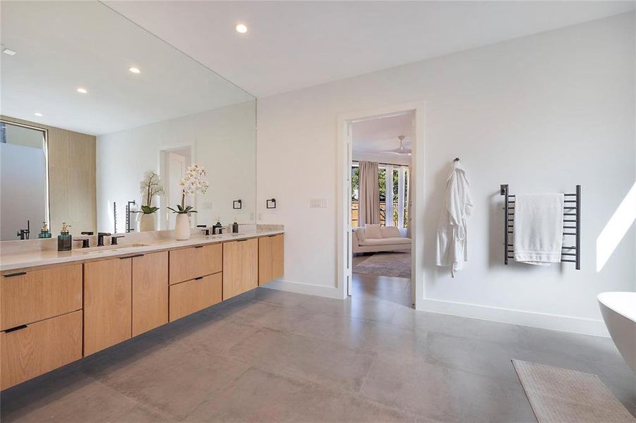 Bathroom with vanity and concrete flooring