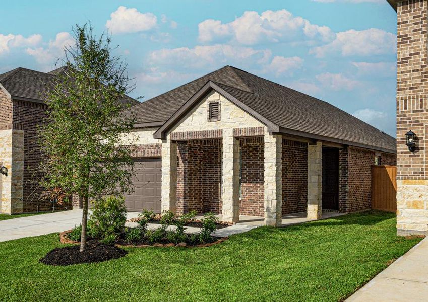 Brick and stone exterior with front yard landscaping