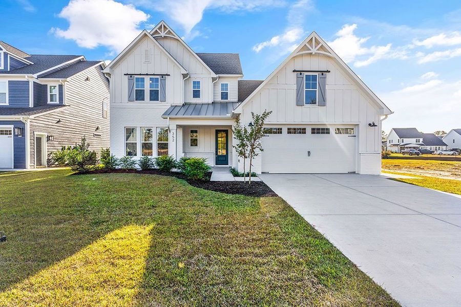 Representative exterior photo of a completed home built from the The Chandler by RobuckHomes in Windwater, Hampstead, NC (Image 23).