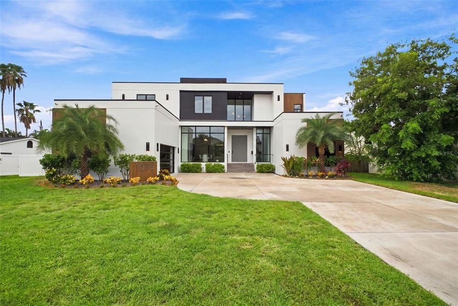 Front exterior of a new home in , St. Petersburg, FL, highlighting curb appeal (Image 2). Front exterior of a new home in , St. Petersburg, FL, highlighting curb appeal (Image 2).