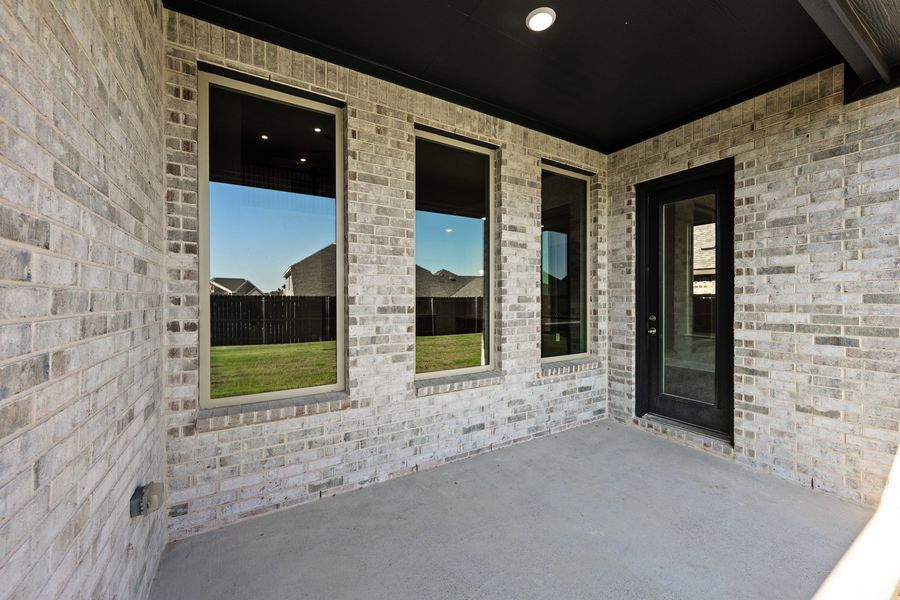 Exterior details and patio area of a home in The Oaks, Red Oak (Image 3). Exterior details and patio area of a home in The Oaks, Red Oak (Image 3).