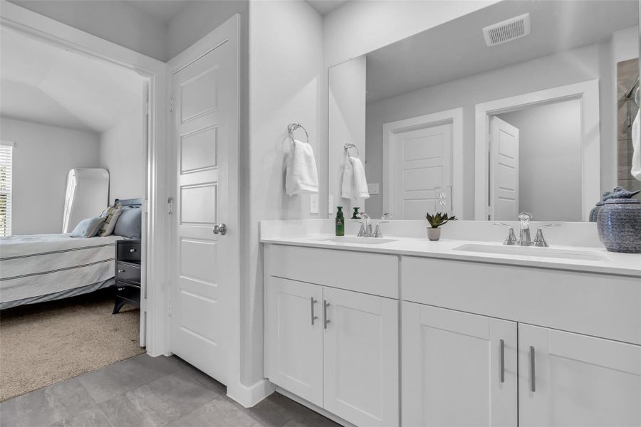 View from primary bath to primary bedroom.  Lots of storage with the linen closet.
