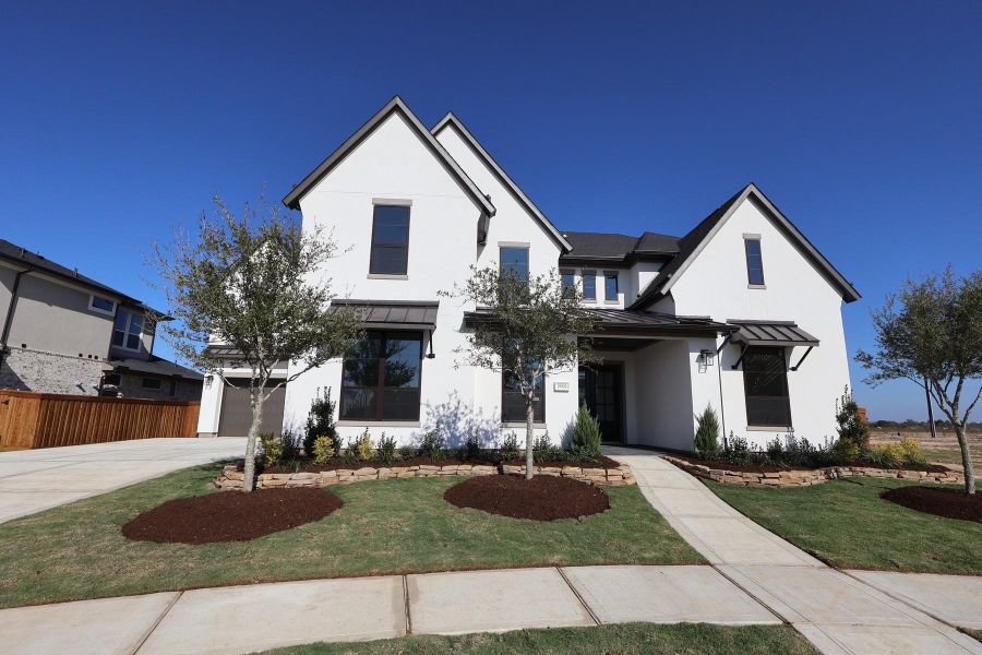 Front exterior of a new home in Dunham Pointe 80′, Cypress, TX, highlighting curb appeal (Image 1). Front exterior of a new home in Dunham Pointe 80′, Cypress, TX, highlighting curb appeal (Image 1).