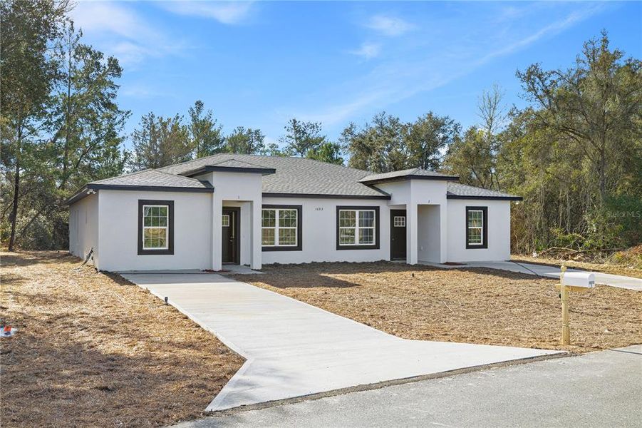 Front exterior of a new home in , Ocala, FL, highlighting curb appeal (Image 18).