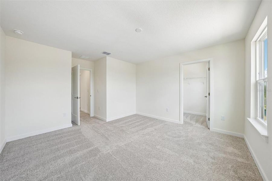 Spacious, unfurnished interior of a new home in Grasslands West, Lakeland (Image 20).