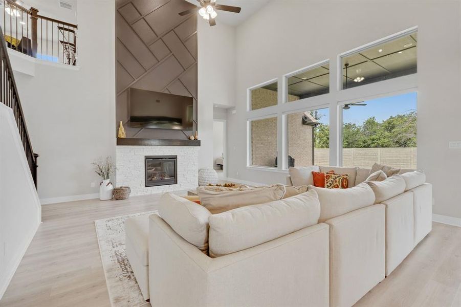 A Distinctive Fireplace Defines The Generously-Sized Family Room Where A Soaring Ceiling Creates Spaciousness.