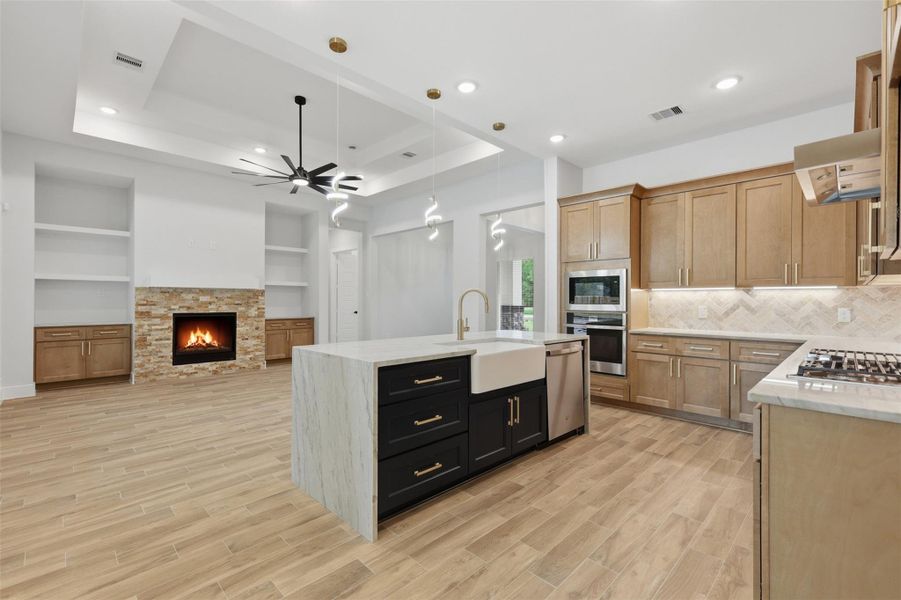 With two-tone custom cabinetry, gold fixtures, and a porcelain farmhouse sink, your friends and family are going to think your home is something straight out of a magazine!