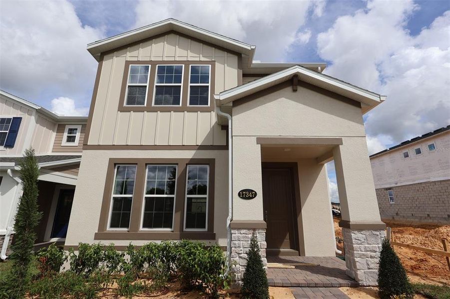 Exterior details and patio area of a home in Lake Star at Ovation, Winter Garden (Image 3).