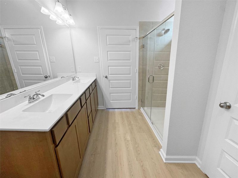 The Waring III- Primary Bathroom with Walk-In Shower, Garden tub not pictured. Under construction, options, upgrades and colors will vary.