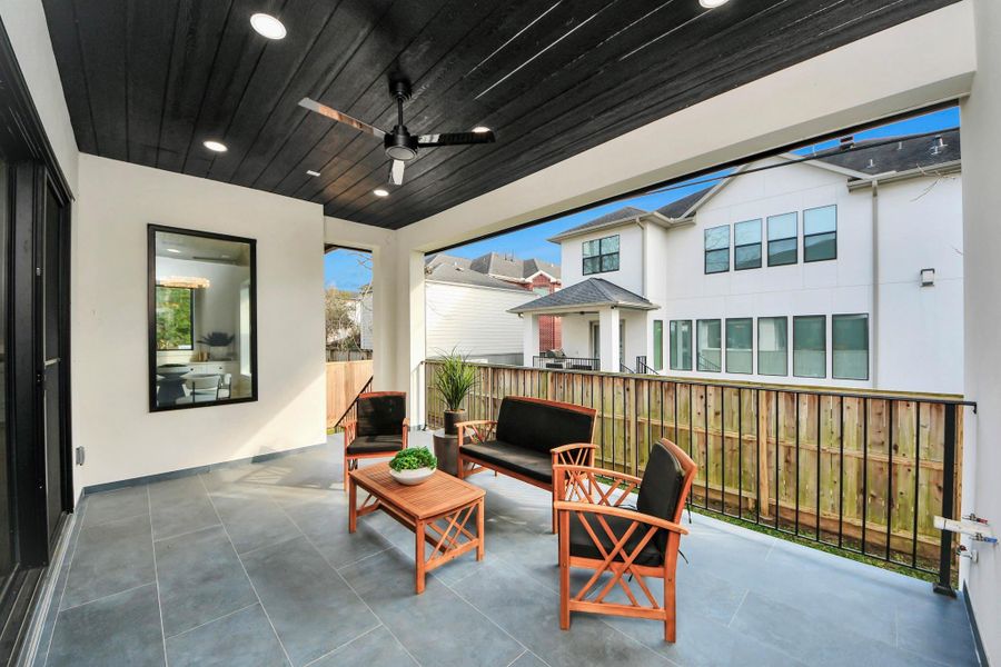 The elevated patio offers expansive outdoor living space, perfect for entertaining or relaxing while enjoying fresh air.
