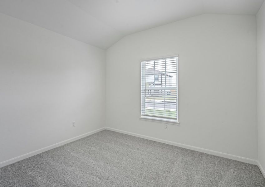 Secondary bedroom with carpet