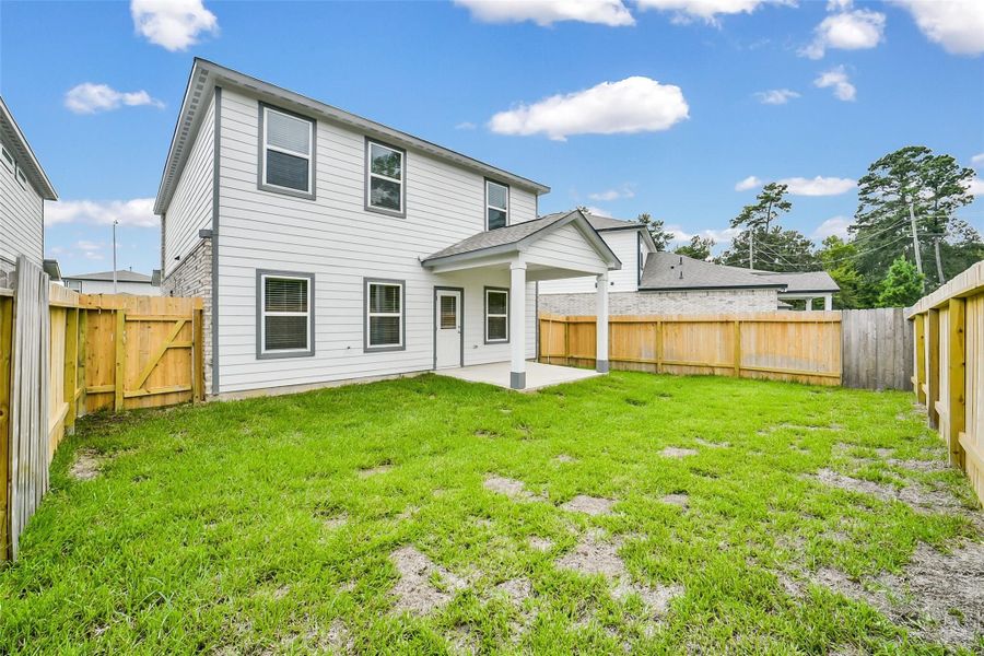 Exterior details and patio area of a home in Lakes at Black Oak, Magnolia (Image 20).