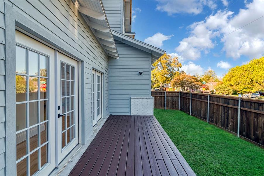 Wooden deck with a lawn