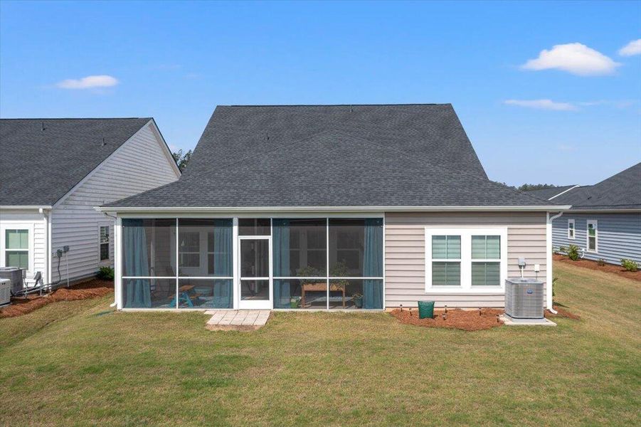 Exterior details and patio area of a home in Horizons at Summers Corner | 55+, Summerville (Image 25).