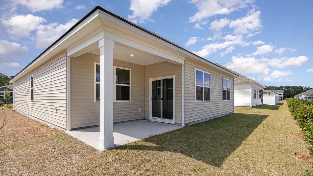 Front exterior of a new home in Heritage Crossing, Conway, SC, highlighting curb appeal (Image 19).
