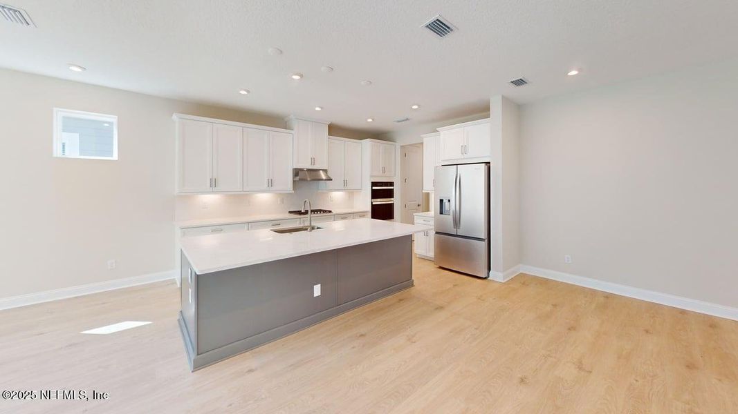 Furnished interior view inside a new home in RiverTown - WaterSong, St. Johns (Image 9).