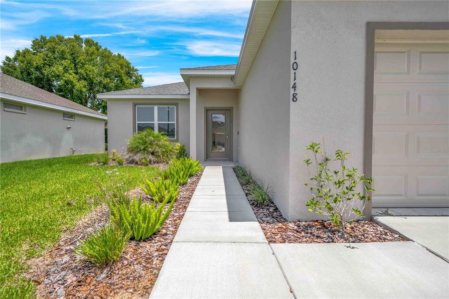 Front exterior of a new home in , Weeki Wachee, FL, highlighting curb appeal (Image 2).