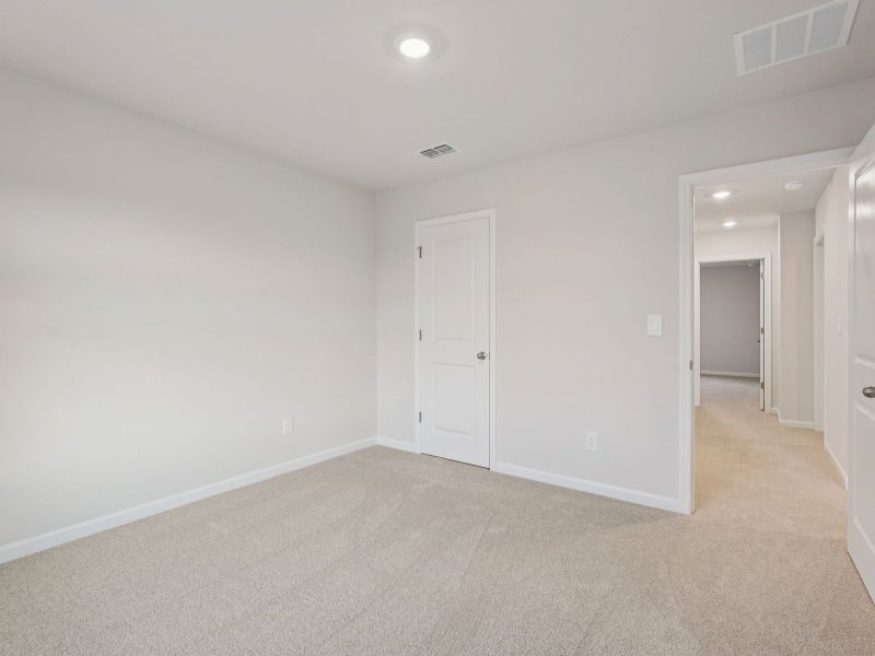Spacious, unfurnished interior of a new home in Vines at Mill Creek - Estate Series, Braselton (Image 19).