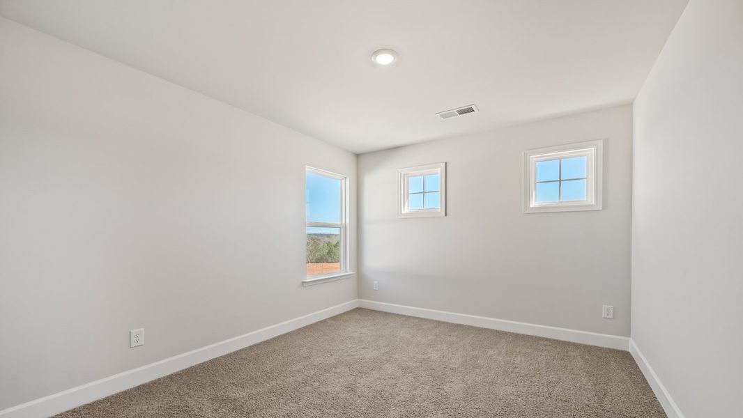Representative unfurnished interior of a home built from the Summit by D.R. Horton in Heritage Pointe, Senoia (Image 27).
