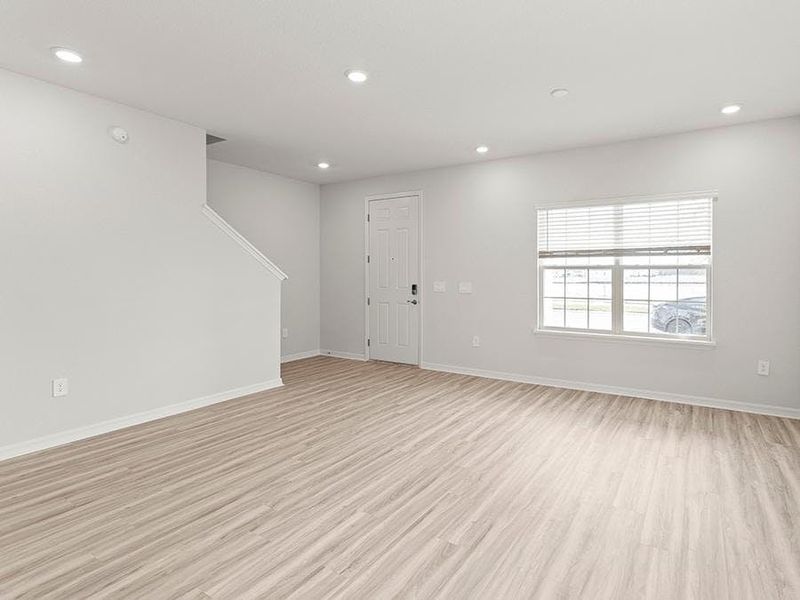 Enjoy a sunny, open living area - Danyella bungalow by Highland Homes