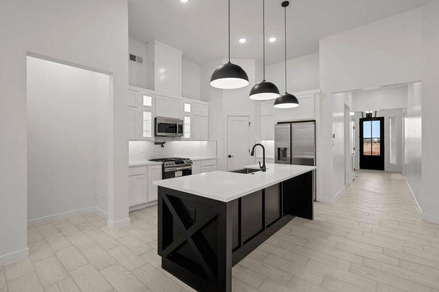 Representative furnished interior of a home built from the Torrey Pines by LEH. Homes in Verdancia, El Paso (Image 31).