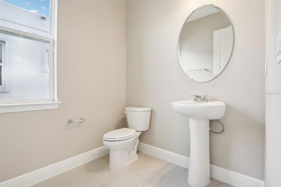 Furnished interior view inside a new home in Laureate Park, Orlando (Image 11).