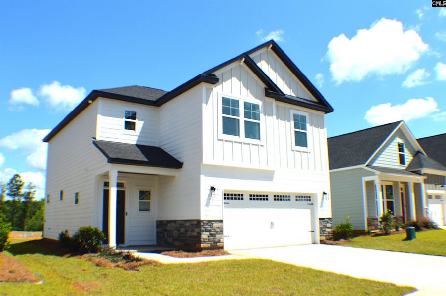 Front exterior of a new home in Bickley Station, Irmo, SC, highlighting curb appeal (Image 22). Front exterior of a new home in Bickley Station, Irmo, SC, highlighting curb appeal (Image 22).