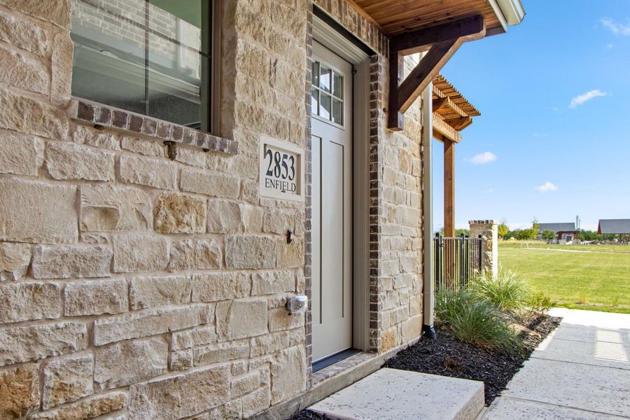 Exterior details and patio area of a home in The Tribute, The Colony (Image 29). Exterior details and patio area of a home in The Tribute, The Colony (Image 29).