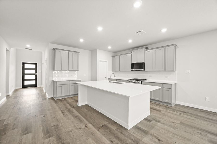Furnished interior view inside a new home in Sunterra, Katy (Image 8).