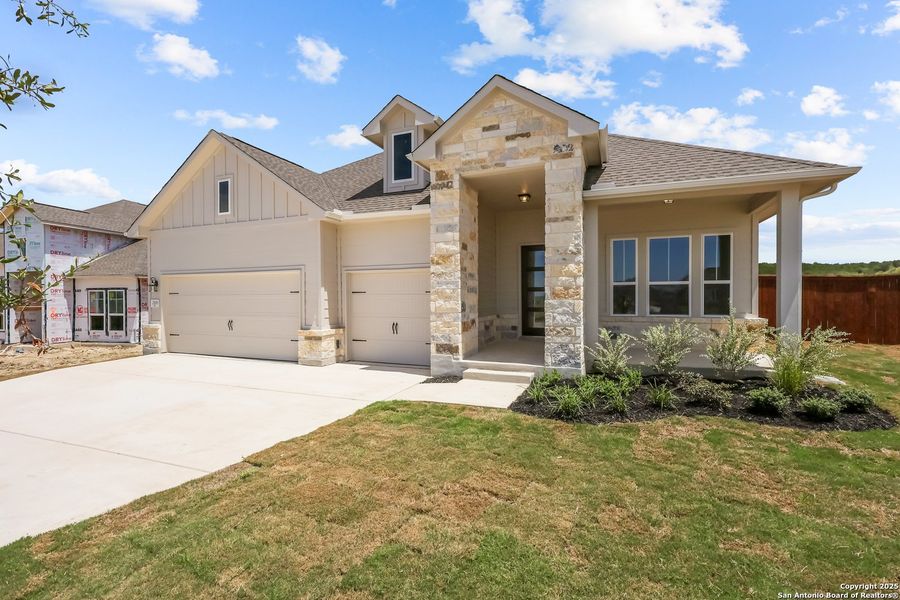 Front exterior of a new home in Homestead, Schertz, TX, highlighting curb appeal (Image 17).