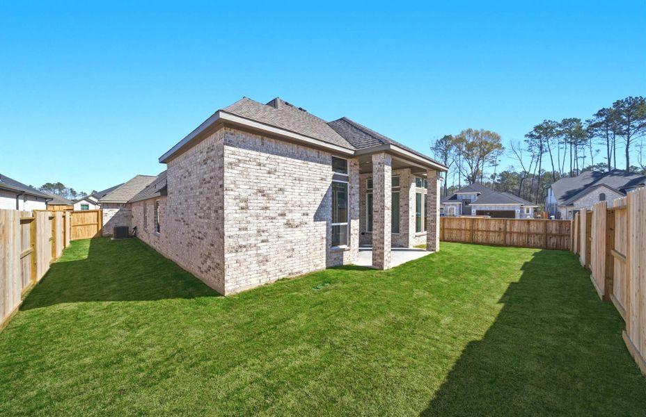 Exterior details and patio area of a home in The Highlands 55′, Porter (Image 22).