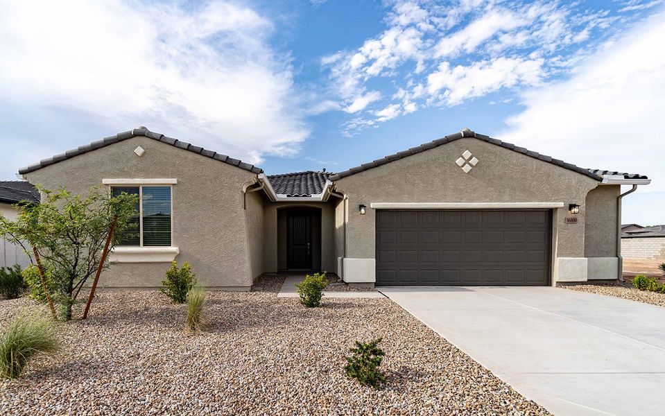 Front exterior of a new home in Rancho Mirage, Maricopa, AZ, highlighting curb appeal (Image 1). Front exterior of a new home in Rancho Mirage, Maricopa, AZ, highlighting curb appeal (Image 1).