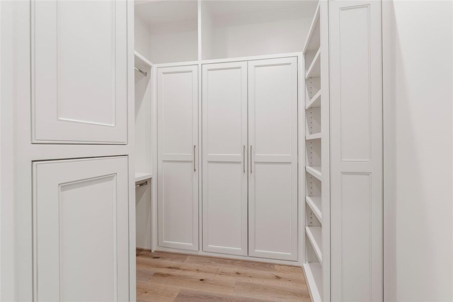 The second primary closet has the same wardrobe boxes, shelves and overhead space overhead: great for extra storage, designer boxes, or ski clothes!