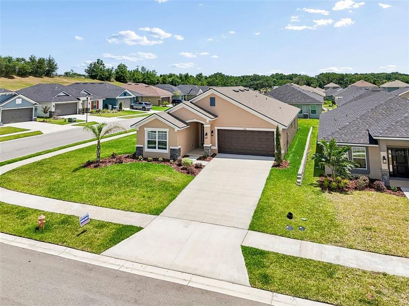 Front exterior of a new home in Abbey Glen, Dade City, FL, highlighting curb appeal (Image 28).