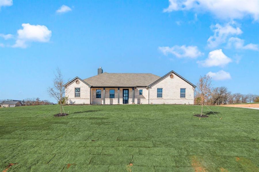 Front exterior of a new home in Saddleback Estates, Boyd, TX, highlighting curb appeal (Image 1).