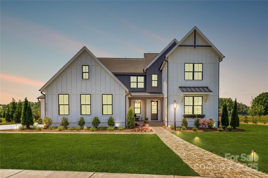 Front exterior of a new home in , Weddington, NC, highlighting curb appeal (Image 1).