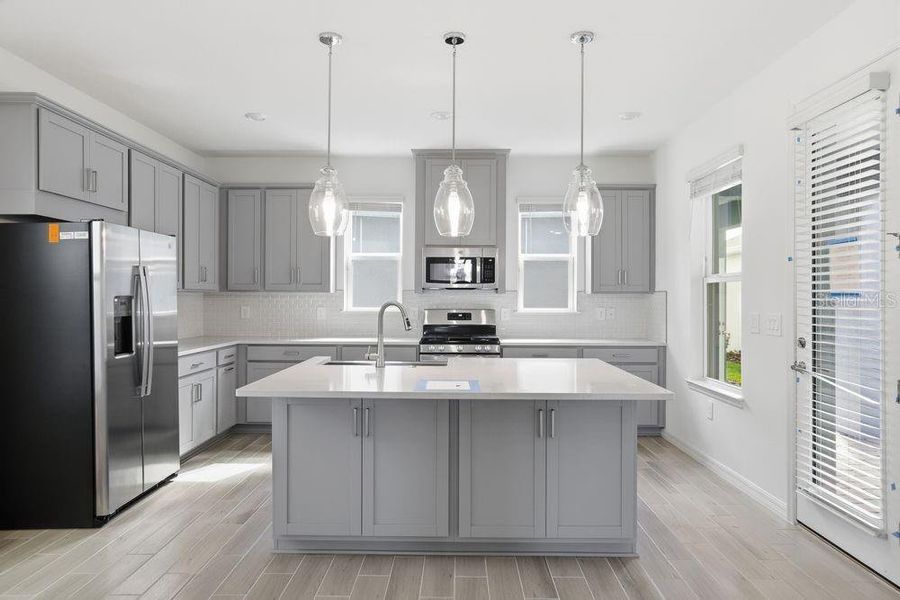 Furnished interior view inside a new home in Harvest at Ovation, Winter Garden (Image 3).