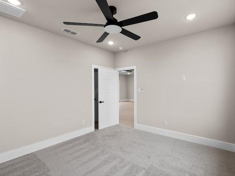 Carpeted empty room with recessed lighting and ceiling fan