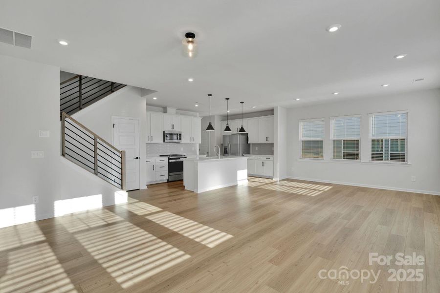 Gorgeous Wood Flooring on Main Level & Modern Iron Railing Gorgeous Wood Flooring on Main Level & Modern Iron Railing