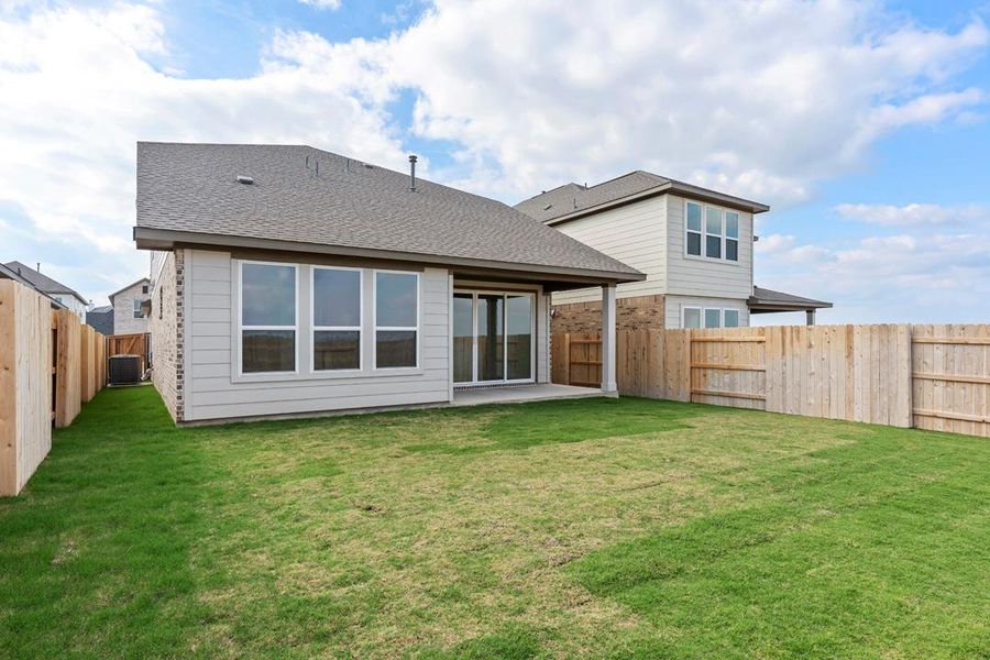 Exterior details and patio area of a home in Lariat, Liberty Hill (Image 29).