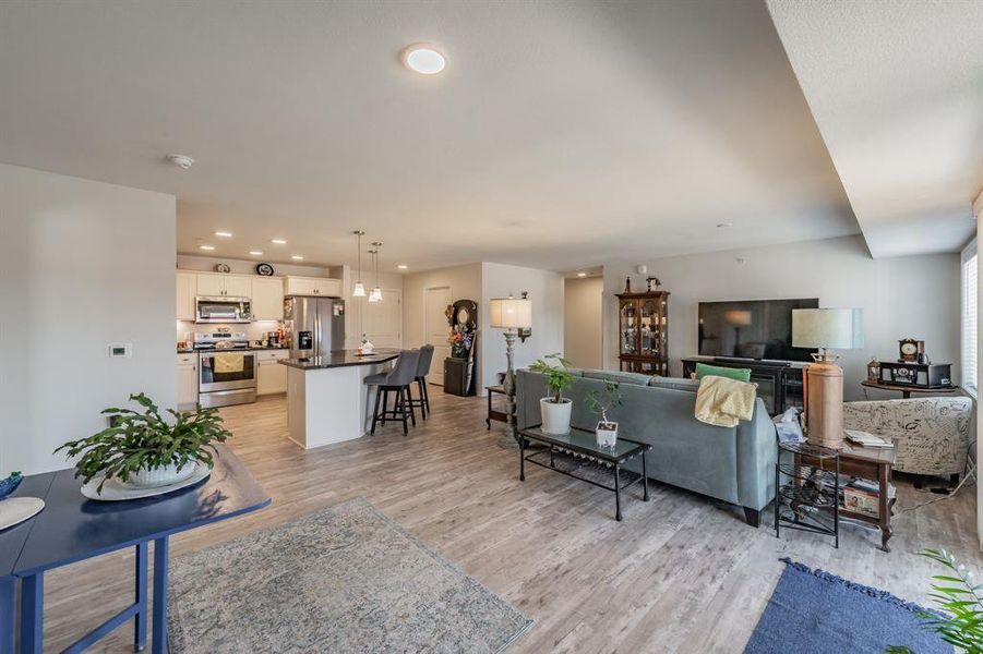 Connected spaces for functionality between kitchen, living, and dining areas.