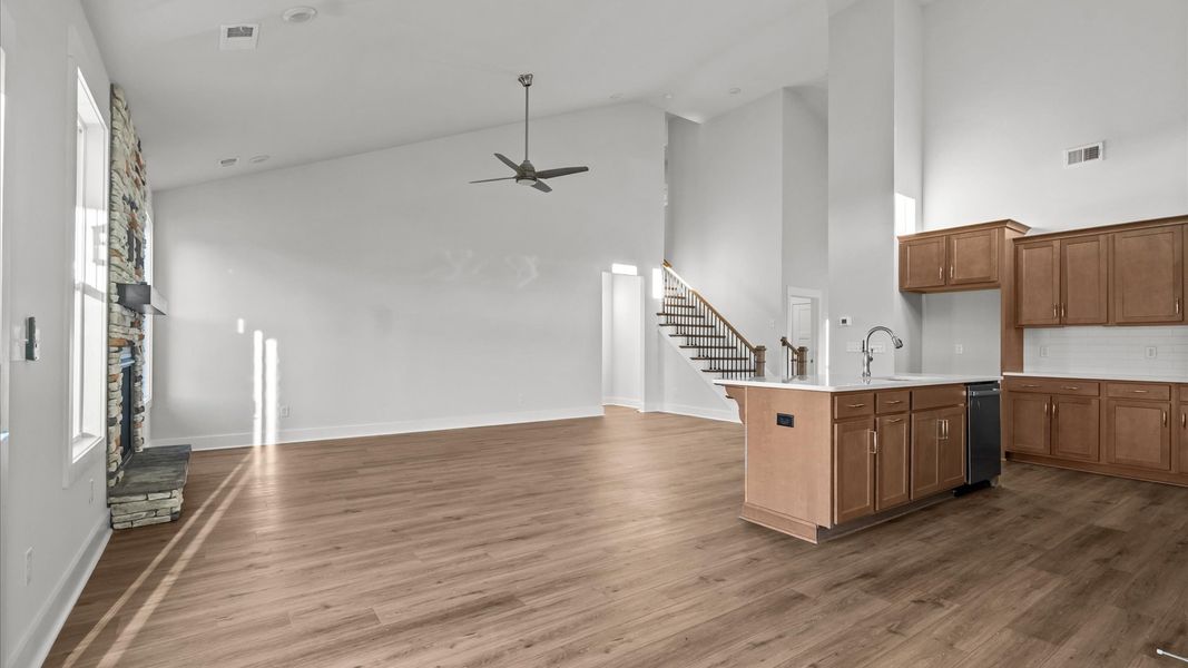 First-class living space featuring expansive ceilings, elegant design, and open sightlines to the kitchen