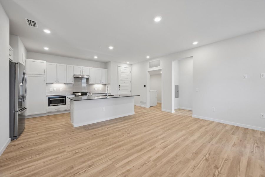 A kitchen with white cabinets. A kitchen with white cabinets.