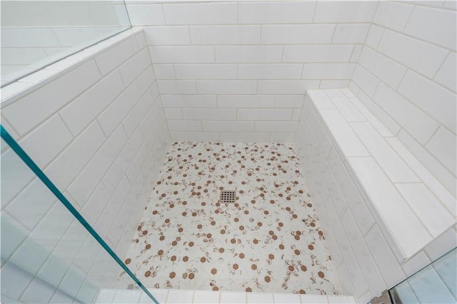 Bathroom view of a tile shower