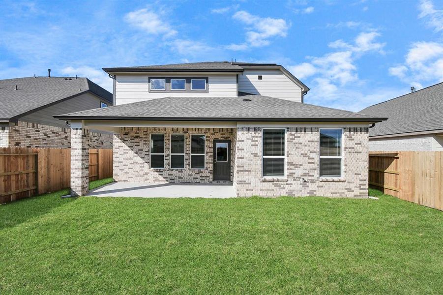 Experience outdoor living at its finest on this expansive covered patio, thoughtfully designed for BBQs and delightful outdoor dining.